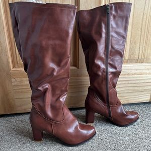 Classy brown, heeled, knee-high boots. Never worn, still in packaging!!